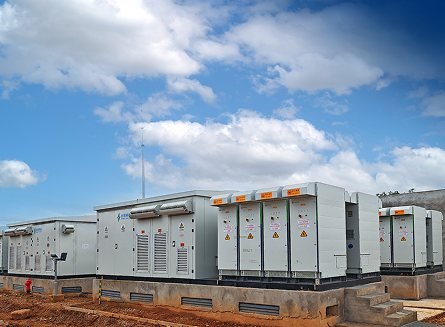 Soaring Electric engineer monitoring energy management system EMS platform at plant